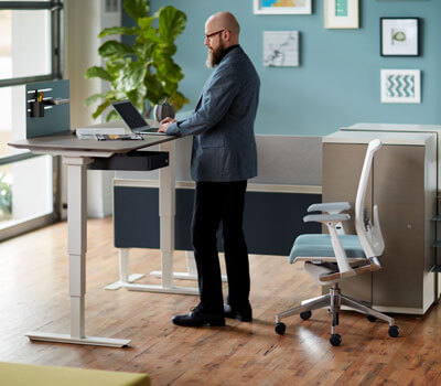 Height adjustable table for sitting or standing